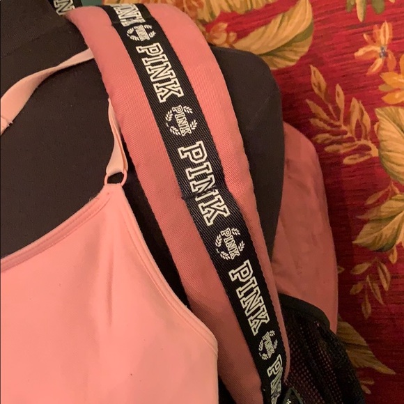 Pink back pack with large logo on bottom. - Picture 5 of 8